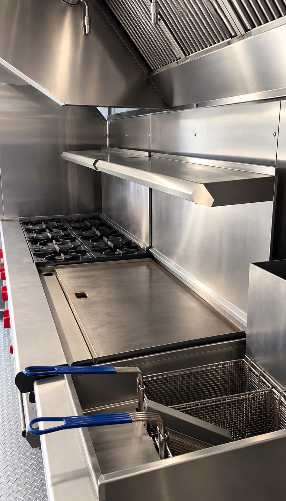 Commercial kitchen trailer griddle range deep fryer.