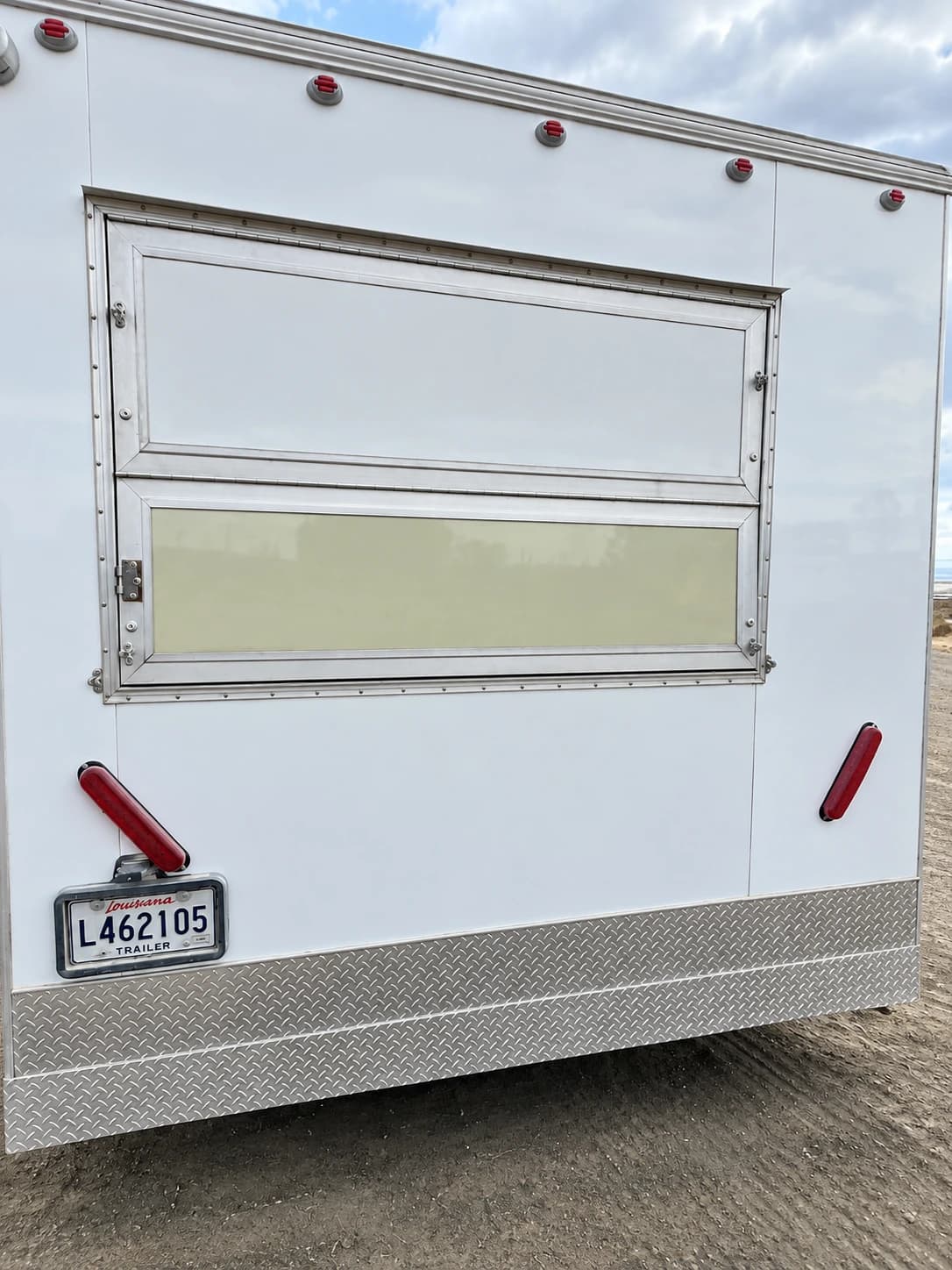Mobile kitchen trailer exterior service window.