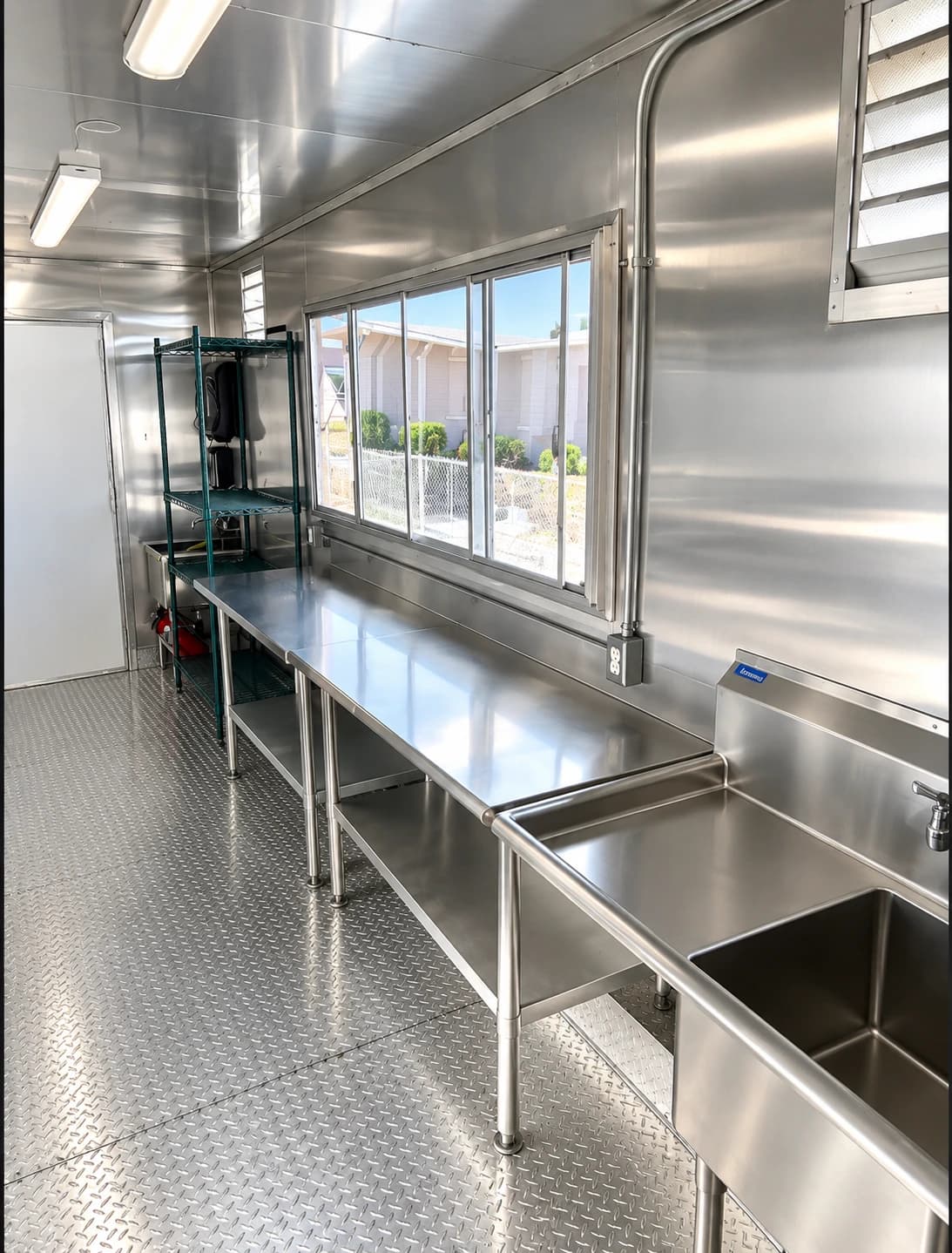 Mobile kitchen trailer prep area service window.